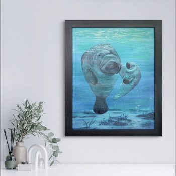 A framed mixed media painting by Jasmine of Jasmine's Art N Designz Studio depicting a mother and calf manatee in an blue realistic underwater scene